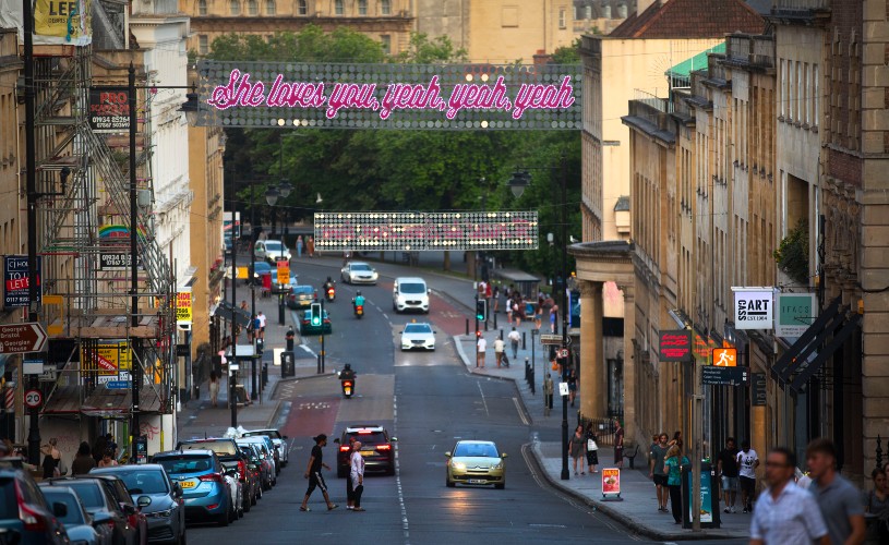 'She loves you, yeah, yeah, yeah' #LoveBristol banner over Park Street